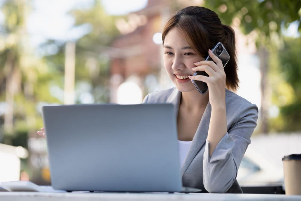Asian girl calling someone with a phone